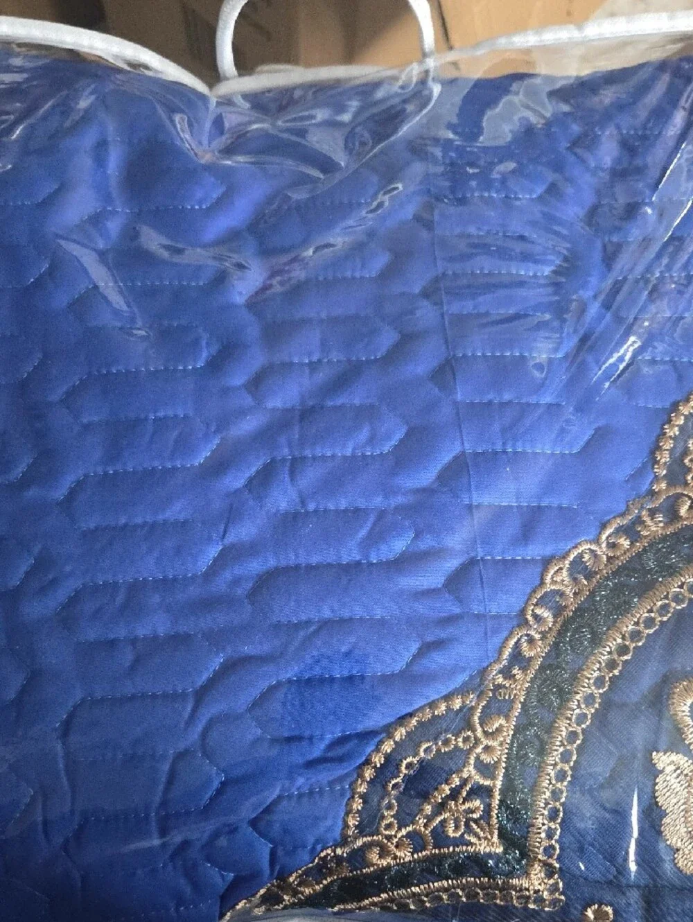 Blue Decorative Bedspread with Gold Accents